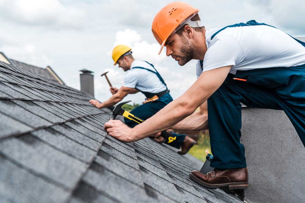 Roofer conducting inspection/repairs